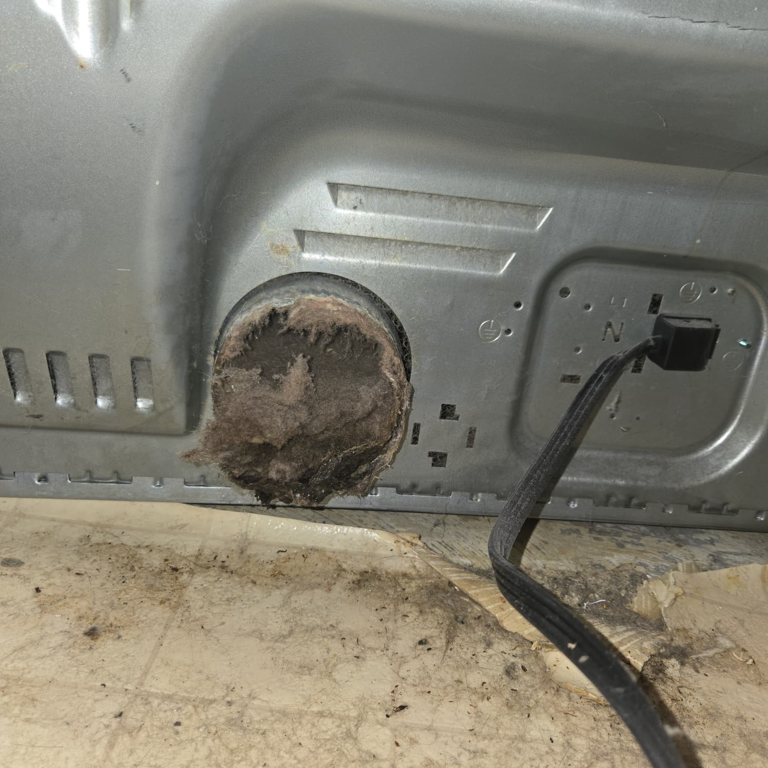 Lint buildup in dryer vent requiring professional cleaning